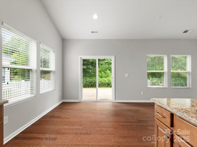 1660 Beleek Ridge Ln, Lake Wylie, SC 29710 - unfurnished living room featuring dark wood-style floors, baseboards, and lofted ceiling