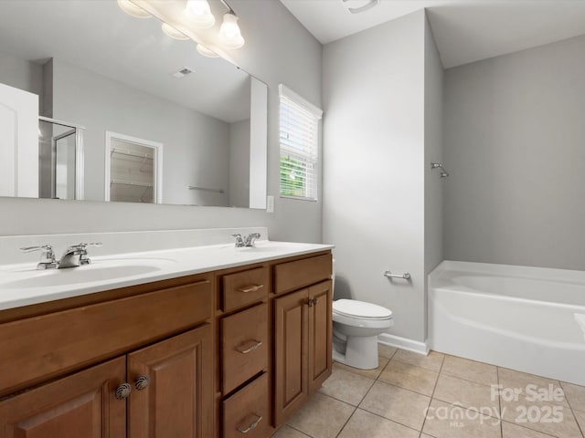 1660 Beleek Ridge Ln, Lake Wylie, SC 29710 - full bathroom featuring tile patterned floors, a stall shower, double vanity, toilet, and a garden tub
