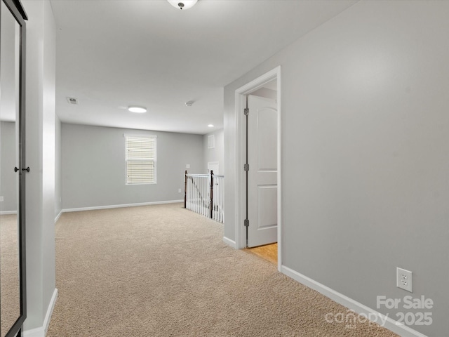 1660 Beleek Ridge Ln, Lake Wylie, SC 29710 - hallway with baseboards, light colored carpet, and an upstairs landing