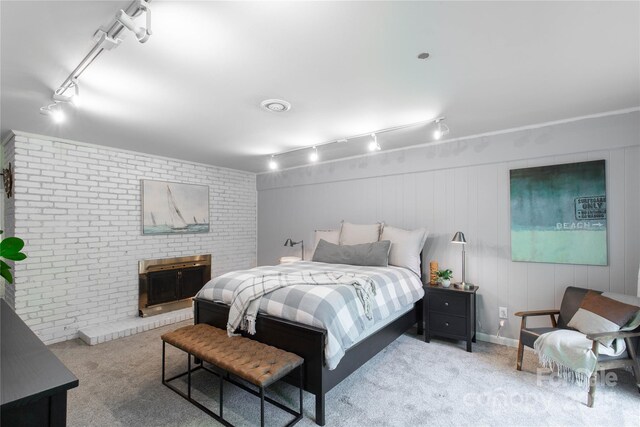 22 Honeysuckle Ln, Clover, SC 29710 - carpeted bedroom featuring track lighting and a fireplace