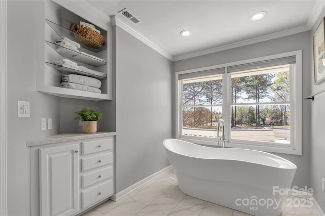 22 Honeysuckle Ln, Clover, SC 29710 - bathroom featuring marble finish flooring, a freestanding tub, baseboards, recessed lighting, and crown molding