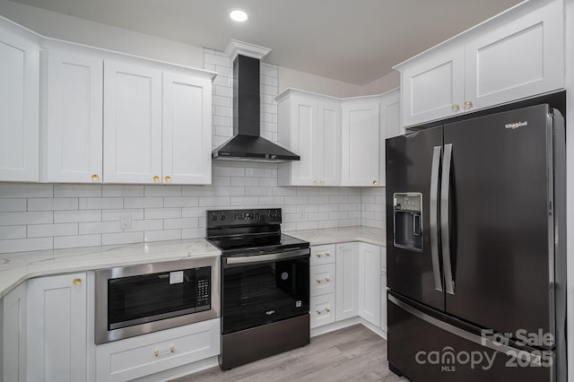 520 E Main St, Dallas, NC 28034 - kitchen featuring black fridge, electric stove, wall chimney exhaust hood, built in microwave, and light stone countertops