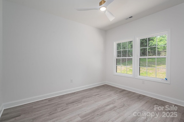 520 E Main St, Dallas, NC 28034 - spare room featuring wood finished floors, plenty of natural light, baseboards, and ceiling fan