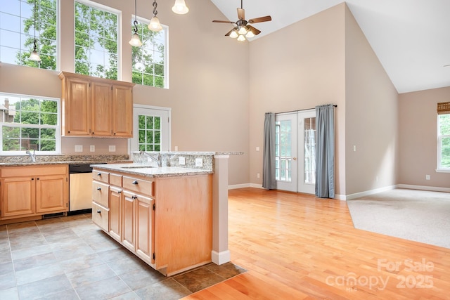 2695 Queens Rd, Lincolnton, NC 28092 - kitchen featuring high vaulted ceiling, light brown cabinets, stainless steel dishwasher, ceiling fan, and a sink