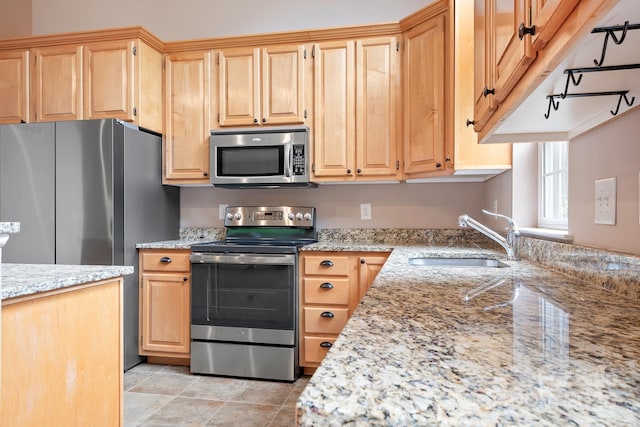 2695 Queens Rd, Lincolnton, NC 28092 - kitchen featuring stainless steel appliances, a sink, light stone countertops, and light brown cabinetry