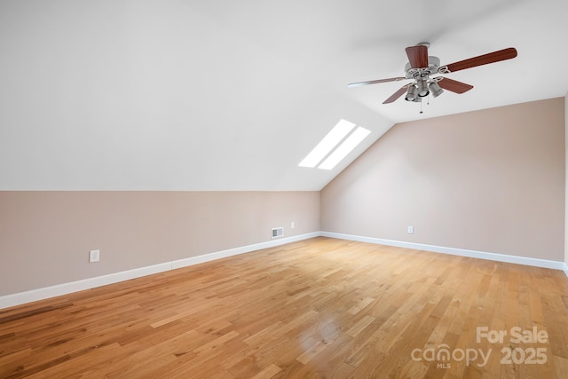 2695 Queens Rd, Lincolnton, NC 28092 - bonus room featuring a skylight, lofted ceiling, light wood-style floors, a ceiling fan, and baseboards