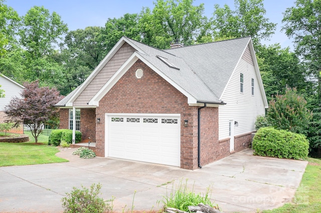 2695 Queens Rd, Lincolnton, NC 28092 - view of front of home with brick siding, concrete driveway, an attached garage, roof with shingles, and a front lawn