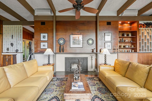 21 Rhododendron Rd, Black Mountain, NC 28711 - living area featuring beamed ceiling, a wall mounted air conditioner, a brick fireplace, ceiling fan, and wooden walls