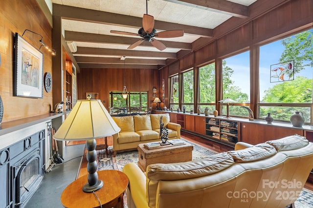 21 Rhododendron Rd, Black Mountain, NC 28711 - living area with wood walls, beam ceiling, and a ceiling fan