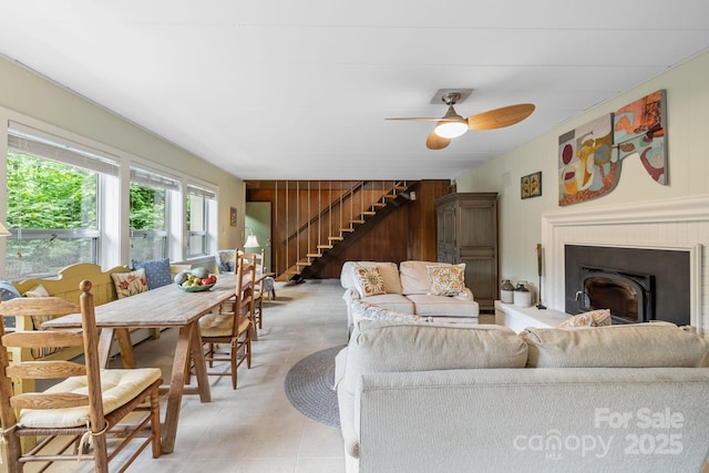 21 Rhododendron Rd, Black Mountain, NC 28711 - living area with stairway, ceiling fan, light tile patterned floors, and a fireplace with raised hearth