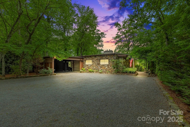 21 Rhododendron Rd, Black Mountain, NC 28711 - view of front of house with driveway, stone siding, and a chimney