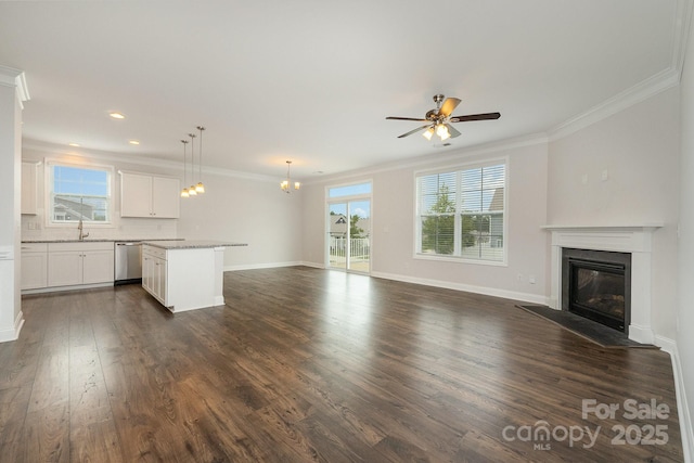 732 Altamonte Dr, Clover, SC 29710 - unfurnished living room with a sink, a glass covered fireplace, ornamental molding, dark wood-style flooring, and ceiling fan