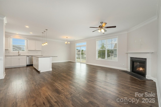 732 Altamonte Dr, Clover, SC 29710 - unfurnished living room featuring a sink, a glass covered fireplace, crown molding, dark wood finished floors, and a ceiling fan