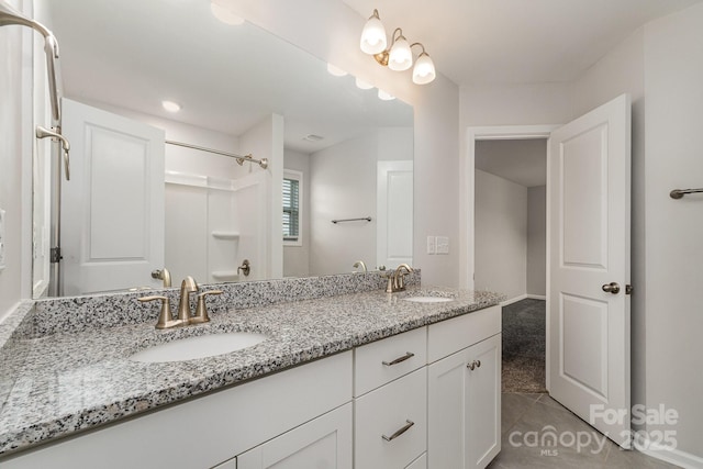 732 Altamonte Dr, Clover, SC 29710 - bathroom featuring double vanity, tile patterned floors, and a shower