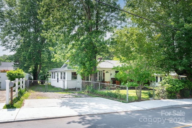 189 Onteora Blvd, Asheville, NC 28803 - view of property hidden behind natural elements with a fenced front yard