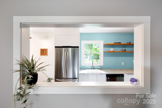 189 Onteora Blvd, Asheville, NC 28803 - kitchen featuring appliances with stainless steel finishes, a sink, white cabinets, light countertops, and open shelves