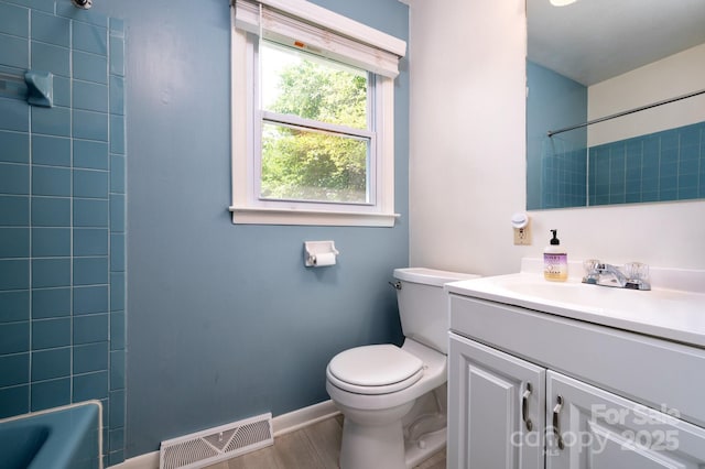 189 Onteora Blvd, Asheville, NC 28803 - bathroom featuring vanity, toilet, wood finished floors, and bathing tub / shower combination