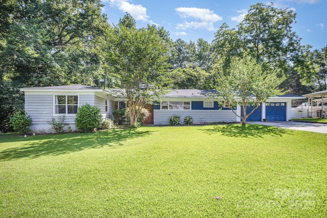 409 Edgewood Ct, Lancaster, SC 29720 - ranch-style home featuring concrete driveway, a front yard, and a garage