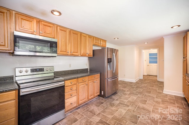 409 Edgewood Ct, Lancaster, SC 29720 - kitchen featuring stainless steel appliances, dark countertops, baseboards, stone finish floors, and recessed lighting