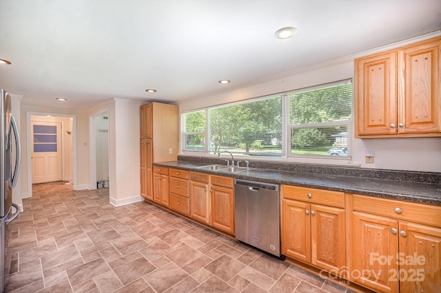 409 Edgewood Ct, Lancaster, SC 29720 - kitchen with appliances with stainless steel finishes, a sink, ornamental molding, stone finish floors, and baseboards
