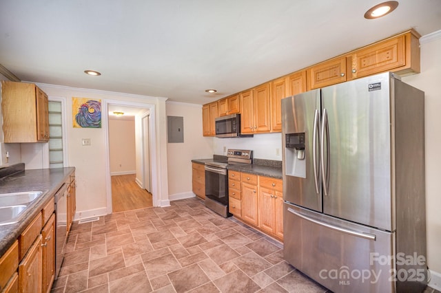 409 Edgewood Ct, Lancaster, SC 29720 - kitchen featuring stainless steel appliances, dark countertops, electric panel, baseboards, and stone finish flooring