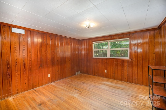 409 Edgewood Ct, Lancaster, SC 29720 - unfurnished room featuring wood finished floors and wood walls