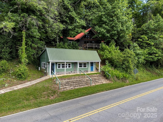 2827 Memorial Hwy, Lake Lure, NC 28746 - view of front facade featuring metal roof and a view of trees