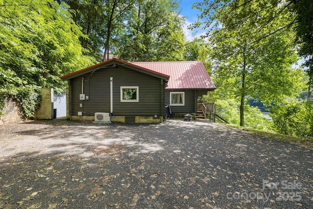 2827 Memorial Hwy, Lake Lure, NC 28746 - back of house featuring ac unit and metal roof