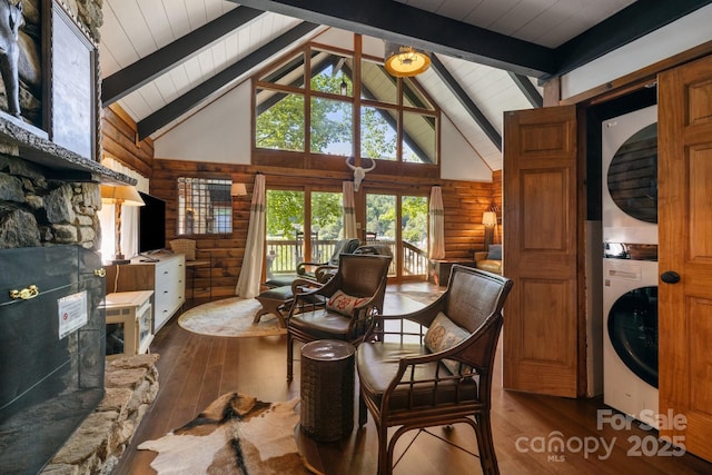 2827 Memorial Hwy, Lake Lure, NC 28746 - dining area featuring stacked washer / drying machine, wood-type flooring, rustic walls, high vaulted ceiling, and wood ceiling with exposed beams