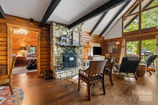 2827 Memorial Hwy, Lake Lure, NC 28746 - dining space featuring beamed ceiling, wood-type flooring, log walls, high vaulted ceiling, and a stone fireplace
