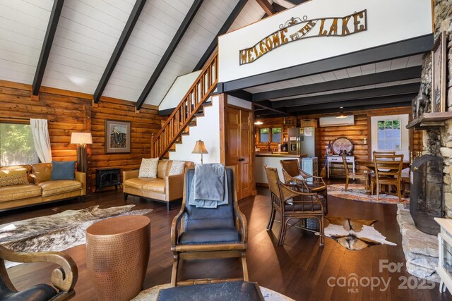 2827 Memorial Hwy, Lake Lure, NC 28746 - living room featuring hardwood / wood-style floors, a wall unit AC, beam ceiling, stairway, and log walls