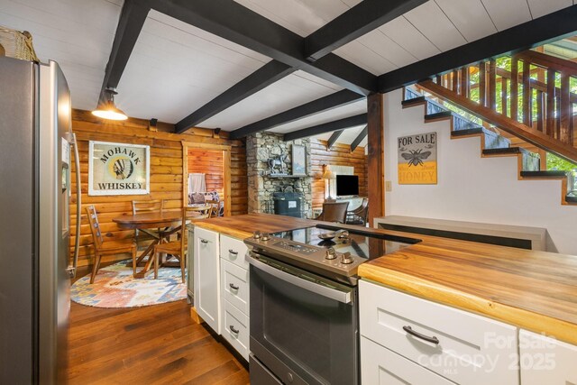 2827 Memorial Hwy, Lake Lure, NC 28746 - kitchen featuring appliances with stainless steel finishes, wood counters, dark wood-style floors, white cabinetry, and a fireplace