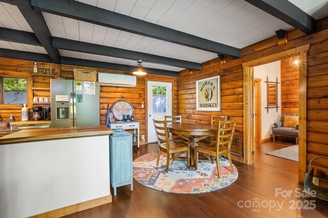 2827 Memorial Hwy, Lake Lure, NC 28746 - dining room with an AC wall unit, dark wood-type flooring, plenty of natural light, beam ceiling, and log walls