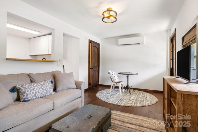 2827 Memorial Hwy, Lake Lure, NC 28746 - living area featuring a wall unit AC, dark wood-style floors, and baseboards