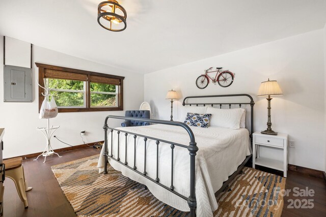 2827 Memorial Hwy, Lake Lure, NC 28746 - bedroom with electric panel, wood finished floors, and baseboards