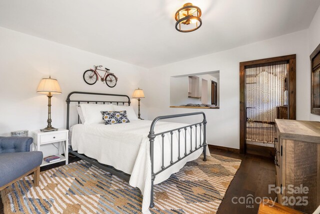 2827 Memorial Hwy, Lake Lure, NC 28746 - bedroom featuring hardwood / wood-style flooring and baseboards