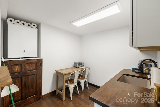 2827 Memorial Hwy, Lake Lure, NC 28746 - office space featuring dark wood-style flooring, a sink, and baseboards
