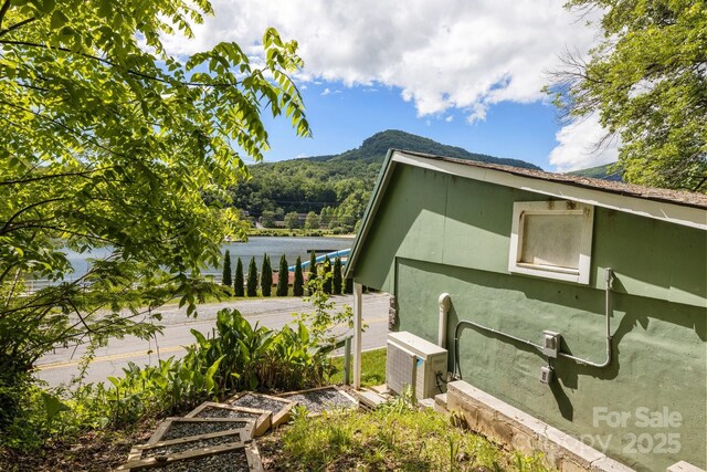 2827 Memorial Hwy, Lake Lure, NC 28746 - view of home's exterior with ac unit and a water view