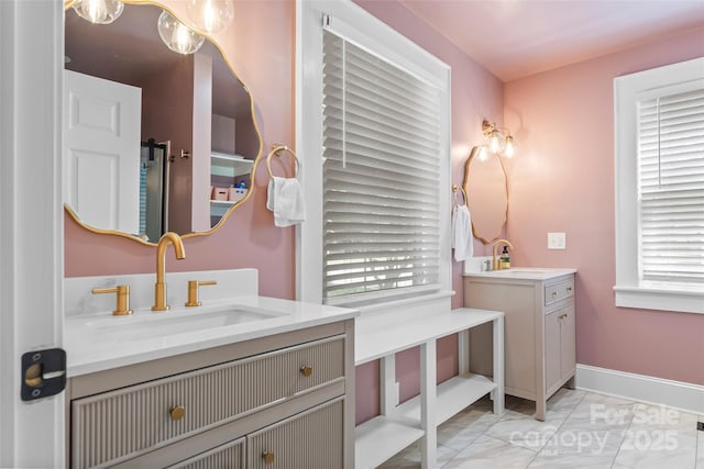 1072 5th St NE, Hickory, NC 28601 - bathroom featuring marble finish floors, vanity, and healthy amount of natural light