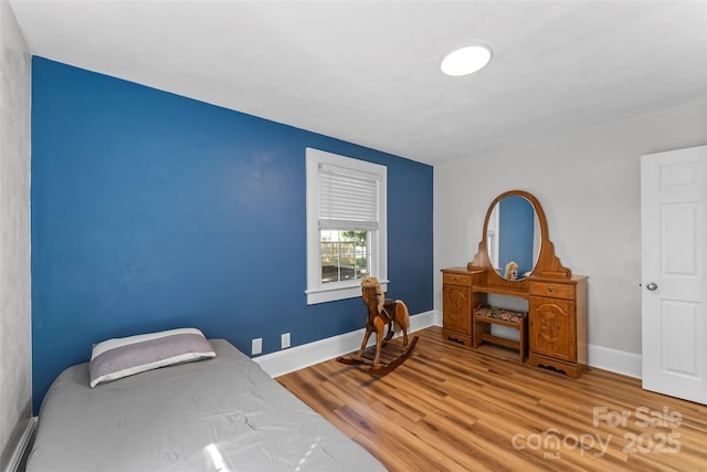 1072 5th St NE, Hickory, NC 28601 - bedroom with wood finished floors and baseboards