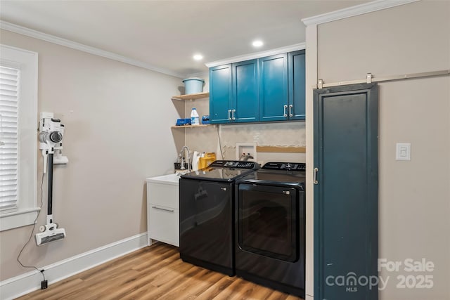 1072 5th St NE, Hickory, NC 28601 - washroom with washing machine and clothes dryer, ornamental molding, light wood-style floors, cabinet space, and recessed lighting