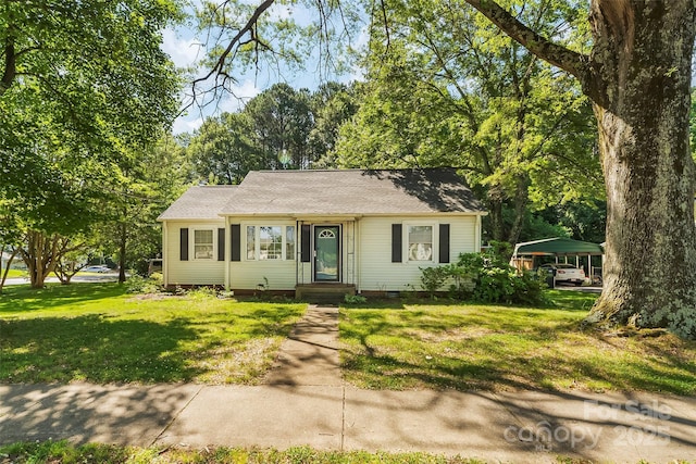 1072 5th St NE, Hickory, NC 28601 - view of front of home with a detached carport, a front yard, crawl space, and roof with shingles