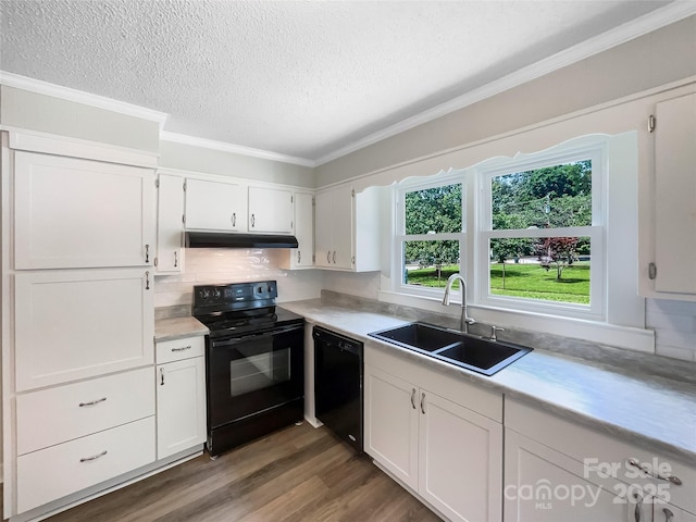 2136 W 6th Ave, Gastonia, NC 28052 - kitchen with black appliances, a sink, under cabinet range hood, a textured ceiling, and light countertops