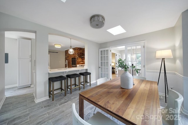 3800 Lovett Cir, Charlotte, NC 28210 - dining area with a skylight and light wood finished floors