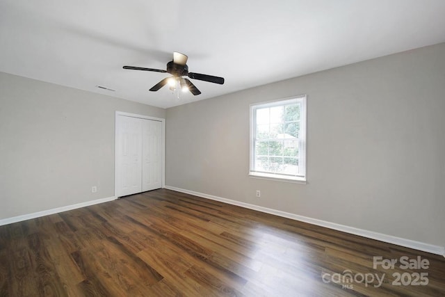 3800 Lovett Cir, Charlotte, NC 28210 - unfurnished bedroom featuring dark wood-style flooring, a closet, and ceiling fan