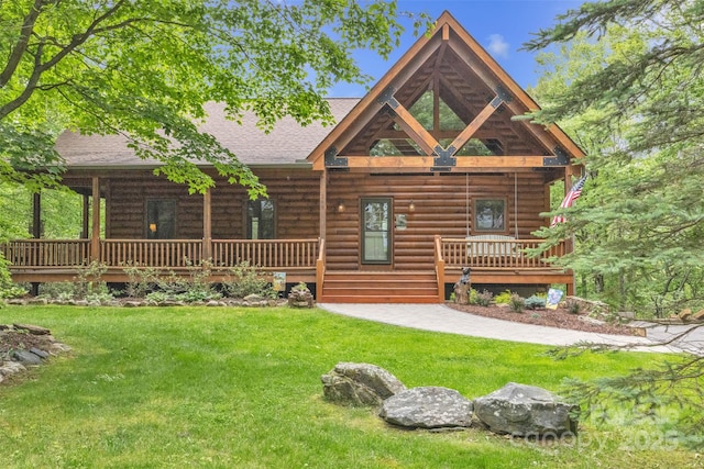 265 Laurel Mountain Estates Dr, Todd, NC 28684 - log cabin with a porch, a front lawn, a shingled roof, and log siding