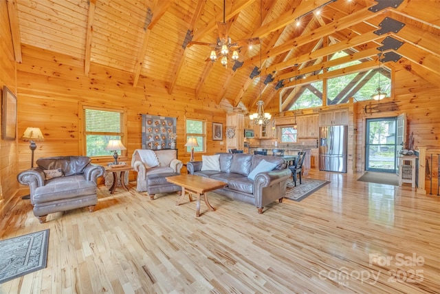 265 Laurel Mountain Estates Dr, Todd, NC 28684 - living area featuring a chandelier, light wood finished floors, wooden walls, high vaulted ceiling, and wooden ceiling with exposed beams