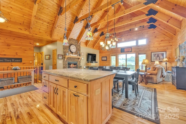 265 Laurel Mountain Estates Dr, Todd, NC 28684 - kitchen featuring high vaulted ceiling, a stone fireplace, open floor plan, light brown cabinets, and wooden ceiling with exposed beams