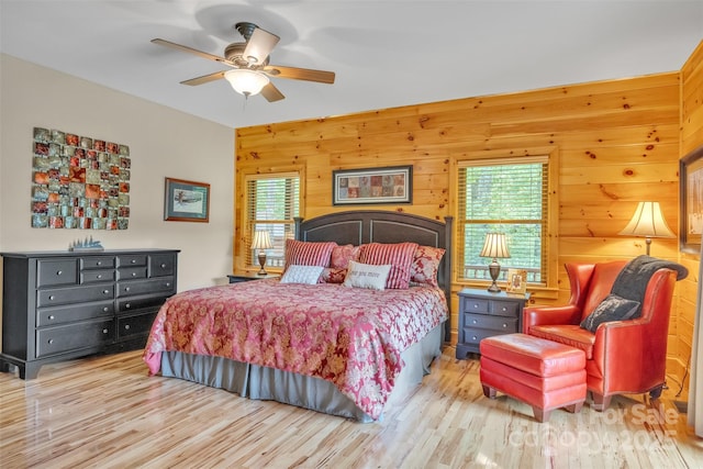 265 Laurel Mountain Estates Dr, Todd, NC 28684 - bedroom featuring multiple windows, wood finished floors, and wood walls