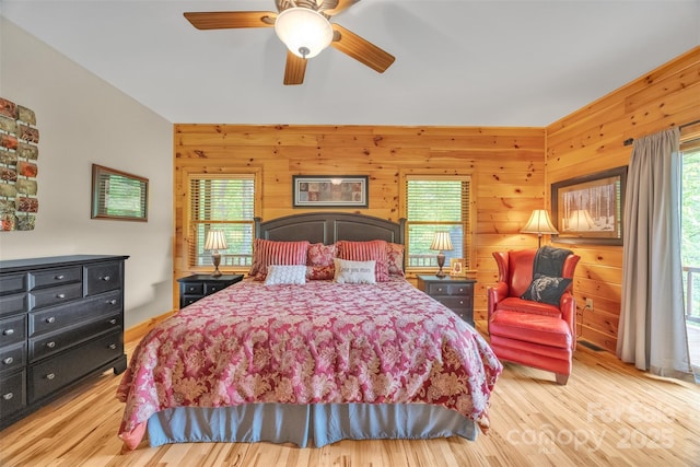 265 Laurel Mountain Estates Dr, Todd, NC 28684 - bedroom with multiple windows, wood finished floors, and wooden walls